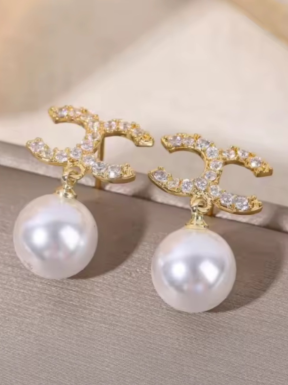 Gold-Tone Pearl Drop Earrings with Crystal-Encrusted Motif